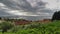 Thunderstorm and cloudscape above sea bay in daylight, panoramic view. Time lapse.