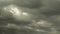 Thunderstorm cloudscape with grey sky. Rain clouds. Dramatic backdrop. Dark huge clouds moving fast