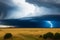 A thunderstorm is coming in the fields of South Africa. The storm is coming