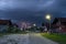 Thunderstorm and dark clouds above suburbs at dusk