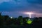 A thunderstorm goes to the village. Lightning hits the ground