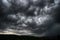 Thunderstorm with heavy rains flying over the dark prairie.