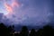 Thunderstorm with lightening during sunset.