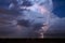 Thunderstorm lightning bolt strike and storm clouds