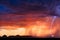 Thunderstorm lightning bolt strike at sunset