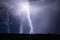 Thunderstorm with lightning bolts in the night sky