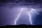 Thunderstorm with lightning bolts and storm clouds