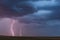 Thunderstorm lightning bolts and stormy sky