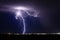 Thunderstorm lightning strike over a city