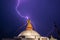 A thunderstorm over of the Bouddnath stupa. Discharge of lightning strikes visible