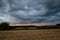 Thunderstorm over the countryside of Romania at sunset