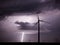 Thunderstorm over a wind farm representing renewable energy