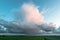Thunderstorm with visible rain shaft is moving over the dutch countryside