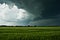 Thundery clouds over a field