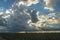 Thundery shower near Rotterdam, Holland with sunbeams shining through the clouds