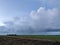 Thundery shower over plain landscape