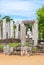Thuparama Buddha statue and the stone columns. World heritage site in the sacred city of Anuradhapura