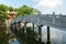 Thuy Trung Tien temple with stone bridge on Thanh Nien street in Hanoi, Vietnam