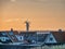 Thyboroen village at sunrise  with windfarm, Denmark