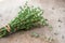 Thyme bunch. Bundle of fresh thymes on a wooden background