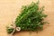 Thyme bunch on wooden background. top view