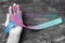 Thyroid Cancer Awareness ribbon Teal Pink Blue color ribbon on woman helping hand support on old aged wood background