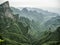 Tianmen Mountain Known as The Heaven`s Gate surrounded by the green forest and mist at Zhangjiagie, Hunan Province, China, Asia