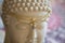 tiara with gemstone on Buddha statue head