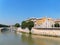 The Tiber River in Rome, Italy with the Church of the Sacred Heart of Jesus in Prati