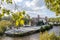 Tiberina Island, surrounded by vegetation and trees washed by water of the Tiber River in the capital of Italy, Rome