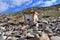 Tibet. Ancient stupa and buddhist prayer stones with mantras and ritual drawings on the trail from the town of Dorchen around moun