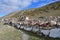 Tibet. Ancient stupas and buddhist prayer stones with mantras and ritual drawings on the trail from the town of Dorchen around mou