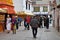 Tibet, Lhasa, China, June, 02, 2018. People walking near one of the smaller ancient Buddhist monasteries in Lhasa on Barkhor stree