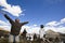 Tibet: man praying with open arms