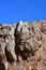 Tibet, one of the geoglyphs on rock on the shore of the sacred lake Nam-Tso Nam Tso against the blue sky, 4718 meters above sea