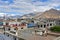 Tibet, view for the roofs of buildings in Lhasa in cloudy summer day