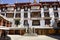 Tibetan Bhuddists wander the courtyard in Drepung Monastery in Lhasa, Tibet.