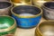 Tibetan Buddhist colored musical bowls. The inscriptions on the bowls, the mantra om mani padme hum , the literal translation of