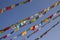 Tibetan Buddhist colored prayer flags on the background of a clear sky