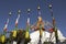 A Tibetan Buddhist colored prayer flags on the background of the temple of the Bodnath stupa and clear blue sky