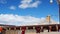 Tibetan buddhist monks and nuns walking at the pagodas in Yarchen Gar Monastery