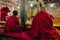 Tibetan Buddhist monks during prayer in Thiksey gompa (Buddhist monastery)
