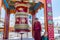 A Tibetan man playing the prayer wheel of Gompa Soma at the  Street of Leh City, Ladakh, Jammu and Kashmir