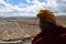 A Tibetan monk overlooking the Yarchen Gar Yaqen Orgyan Temple