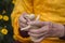 Tibetan monk sculpts figure of the deity barley flour tsampa in Nepal