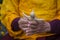 Tibetan monk sculpts figure of the deity barley flour tsampa in Nepal