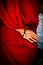 A Tibetan monks hand behind his back in Pokhara, Nepal