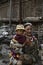 Tibetan mother holding his son in the sun.