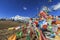 Tibetan Prayer Flags on foreground and Jade Dragon Snow Mountain on background