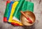 Tibetan prayer flags and singing bowl on a gray concrete background